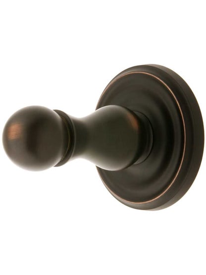 Solid Brass Single Hook Post with Classic Rosette in Oil Rubbed Bronze.